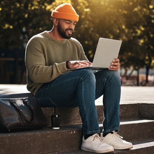 male student attending remote lecture