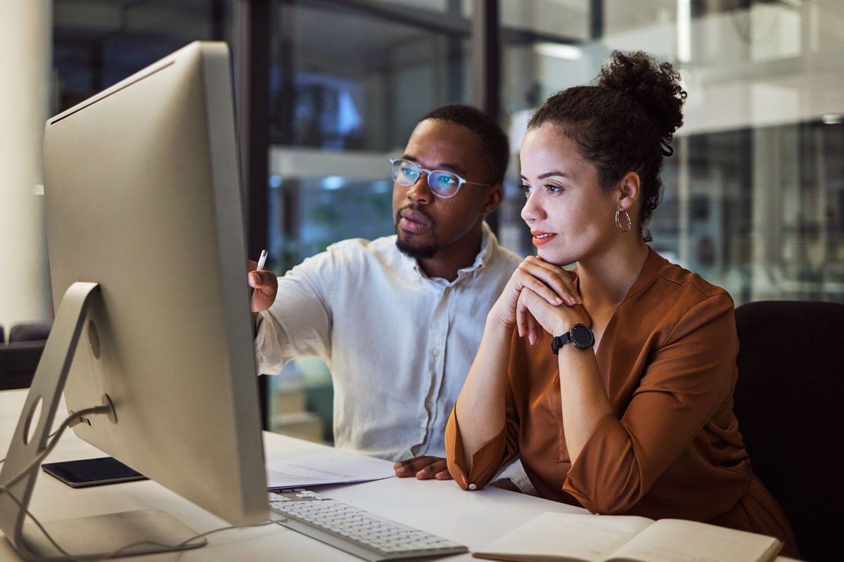coworkers-collaborating-on-project-computer