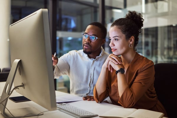coworkers-collaborating-on-project-computer