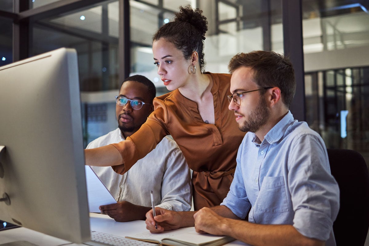 team-collaboration-reviewing-project-on-computer