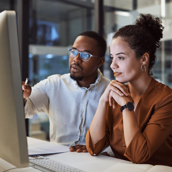 two people working on computer